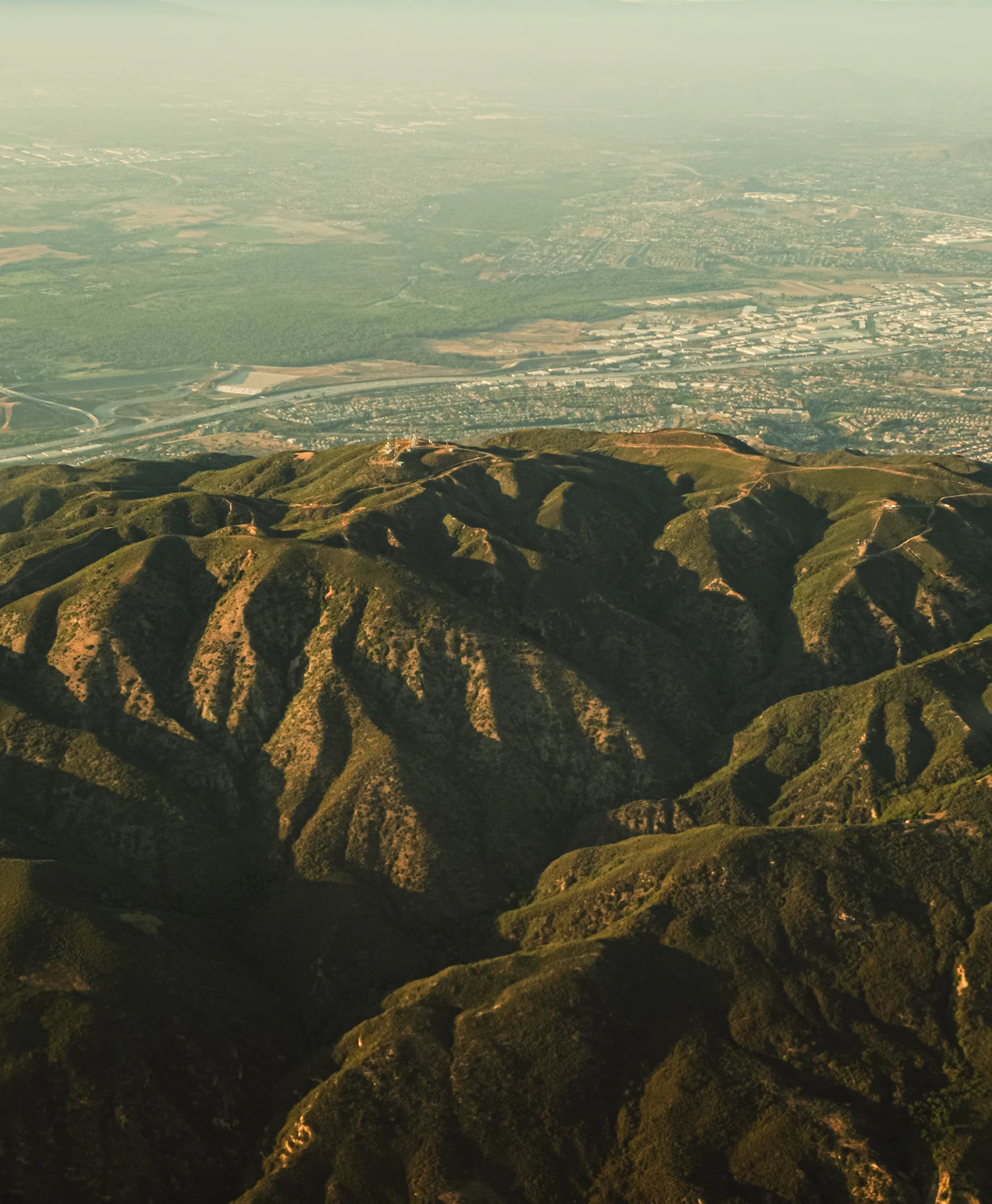 Aerial view across Santa Ana toward the surrounding mountains