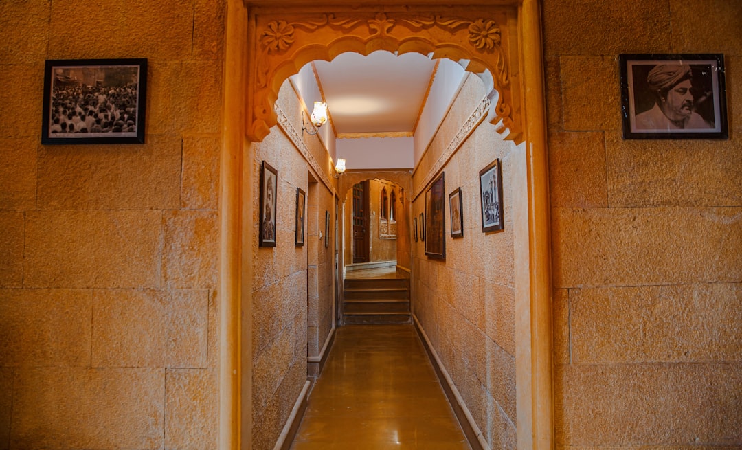 a long hallway with pictures on the walls