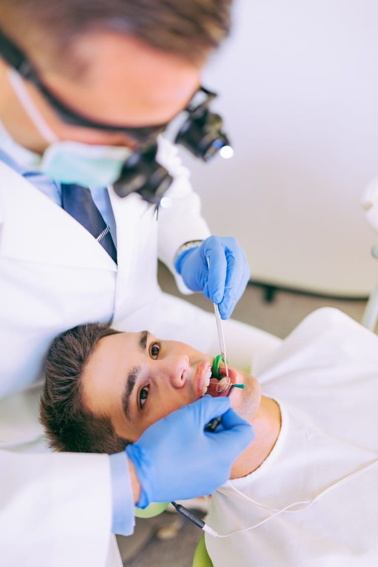 Patient receiving a dental checkup in a professional dental office