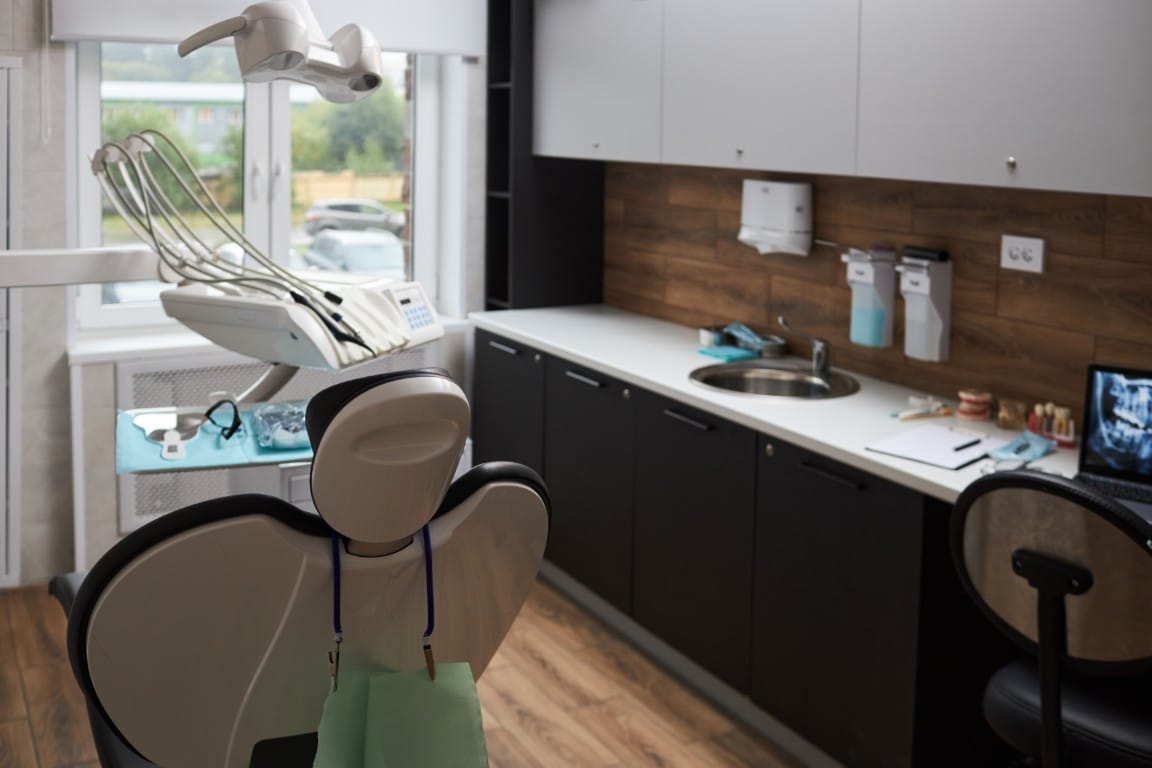 Modern dental clinic interior with clean treatment rooms and equipment