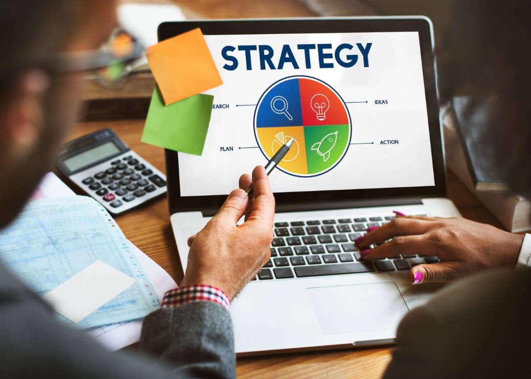 Marketing strategy session with analytics data on screen