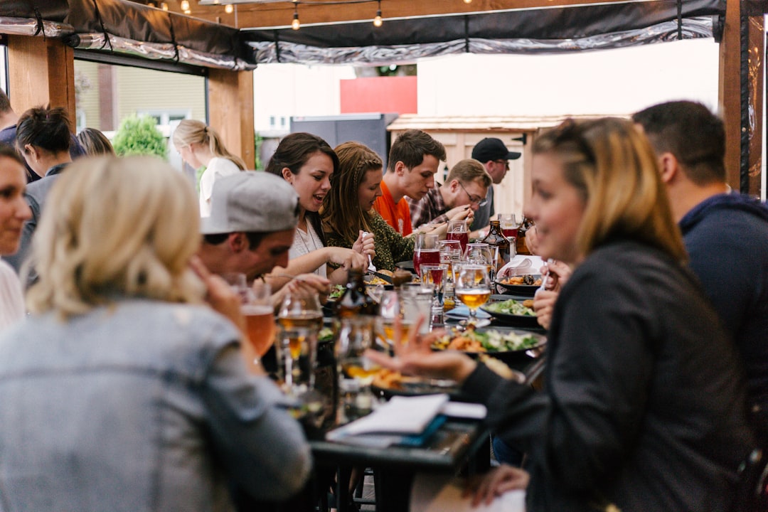 restaurant marketing agency — people sitting in front of table talking and eating