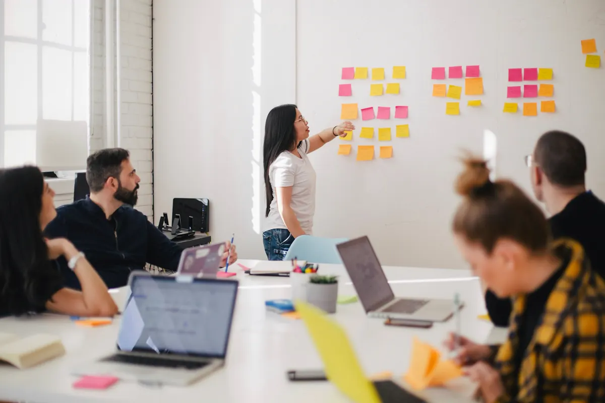 Brand strategy workshop with a team reviewing ideas on a whiteboard