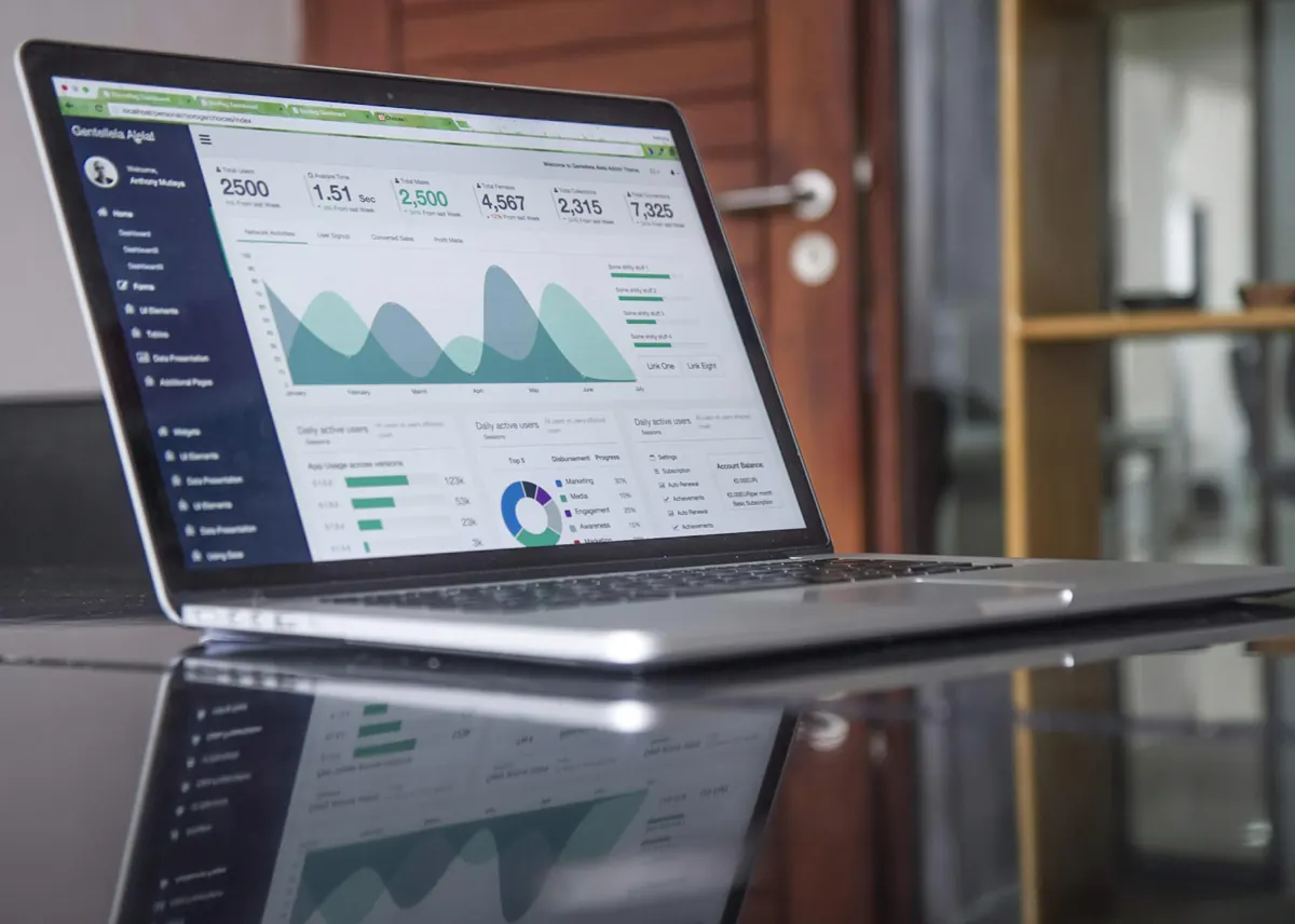 Laptop showing website analytics for a local business marketing campaign